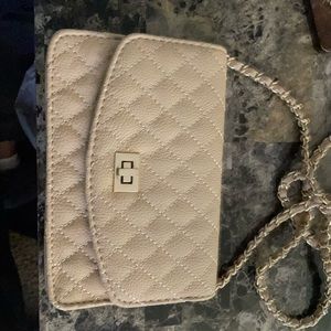 Pretty nude color crossbody bag.